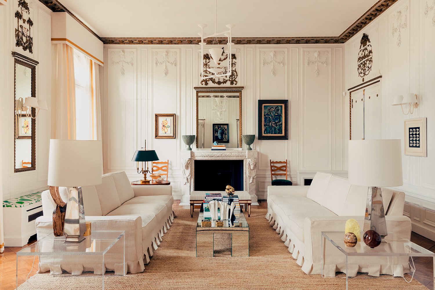 White living room with both antique and modern pieces