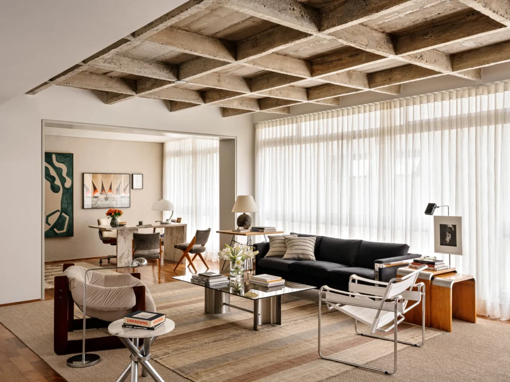 Modernist Apartment with an open space living room and a brutalist design ceiling and a study