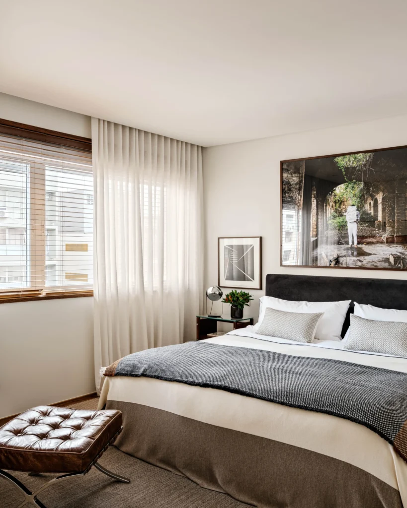 Modernist Apartment bedroom with custom-made bed and side tables