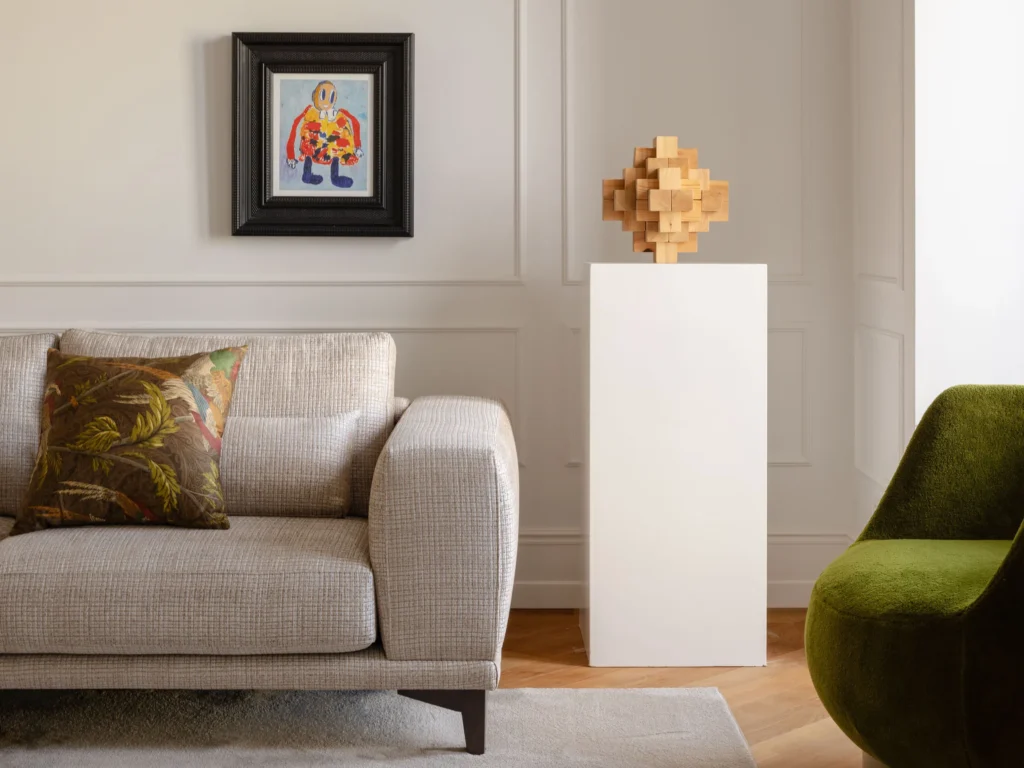 Contemporary Interior Design living room with a gray modern sofa and with decorative molding on the wall