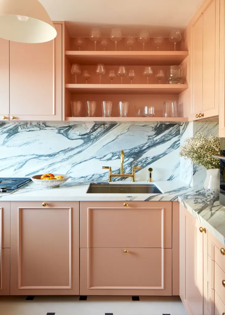 luxury apartment kitchen with pink cabinets and with marble backsplash