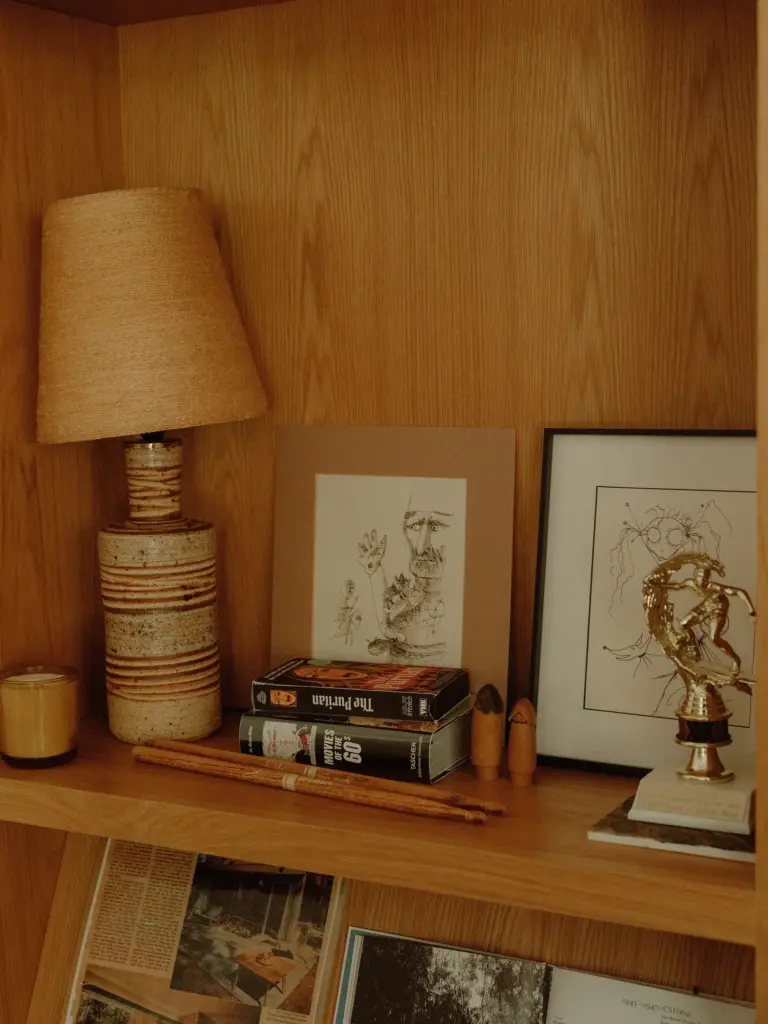 Mid-Century Modern house with a wooden built-in bookcase with personal books and accessories