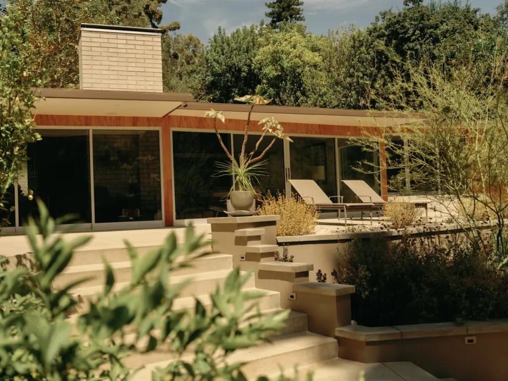 Mid-Century Modern house with large windows and with concrete floors