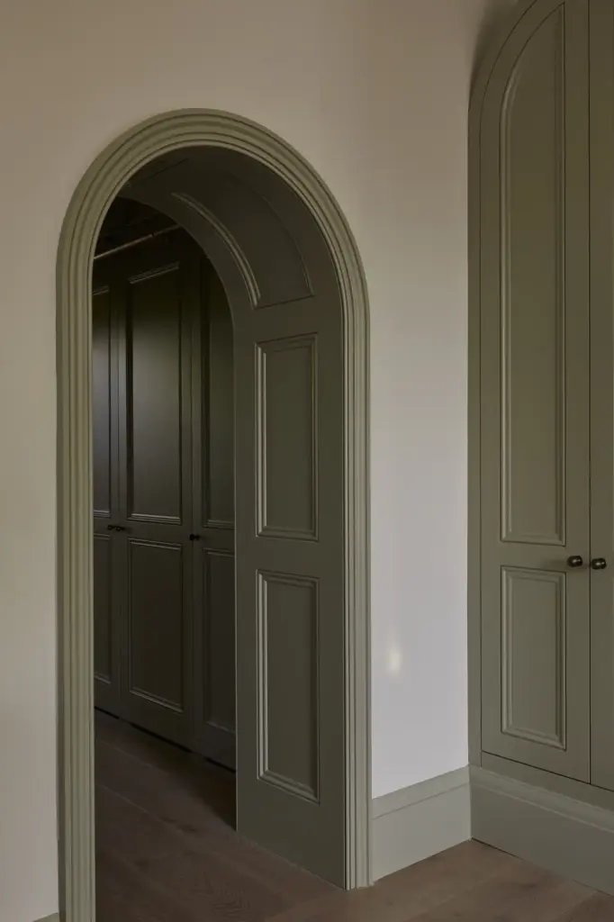 Organic Modernism style hallway with cream walls and green details 