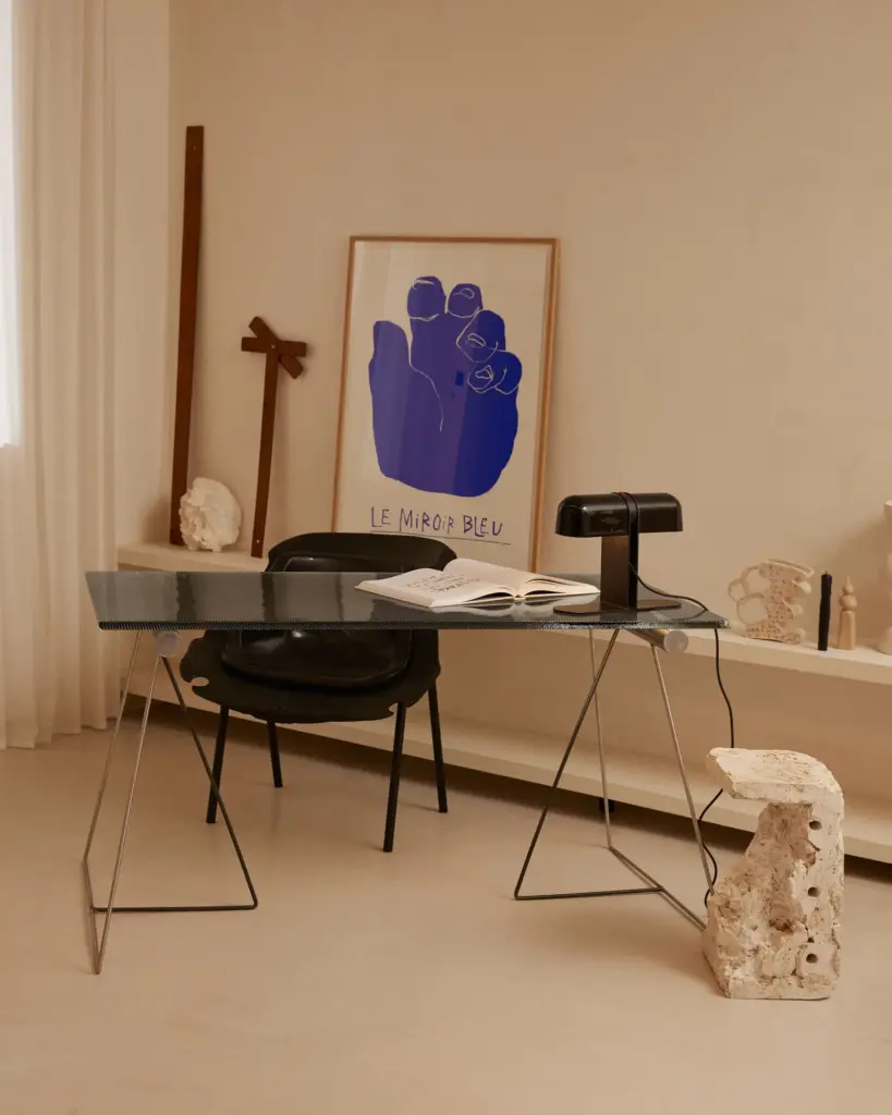 Apartment Renovation in Barcelona with cream walls and with cream floors and with a dark desk and with a travertine side table and with a desk lamp