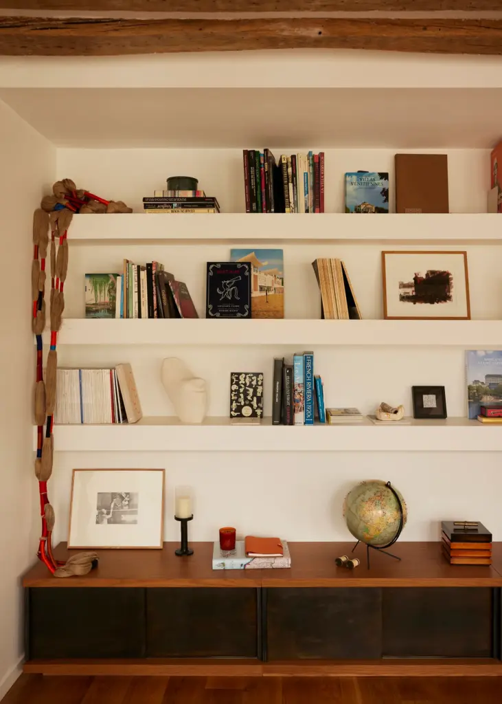 French interior design home with a custom book shelf and with a wood cabinet