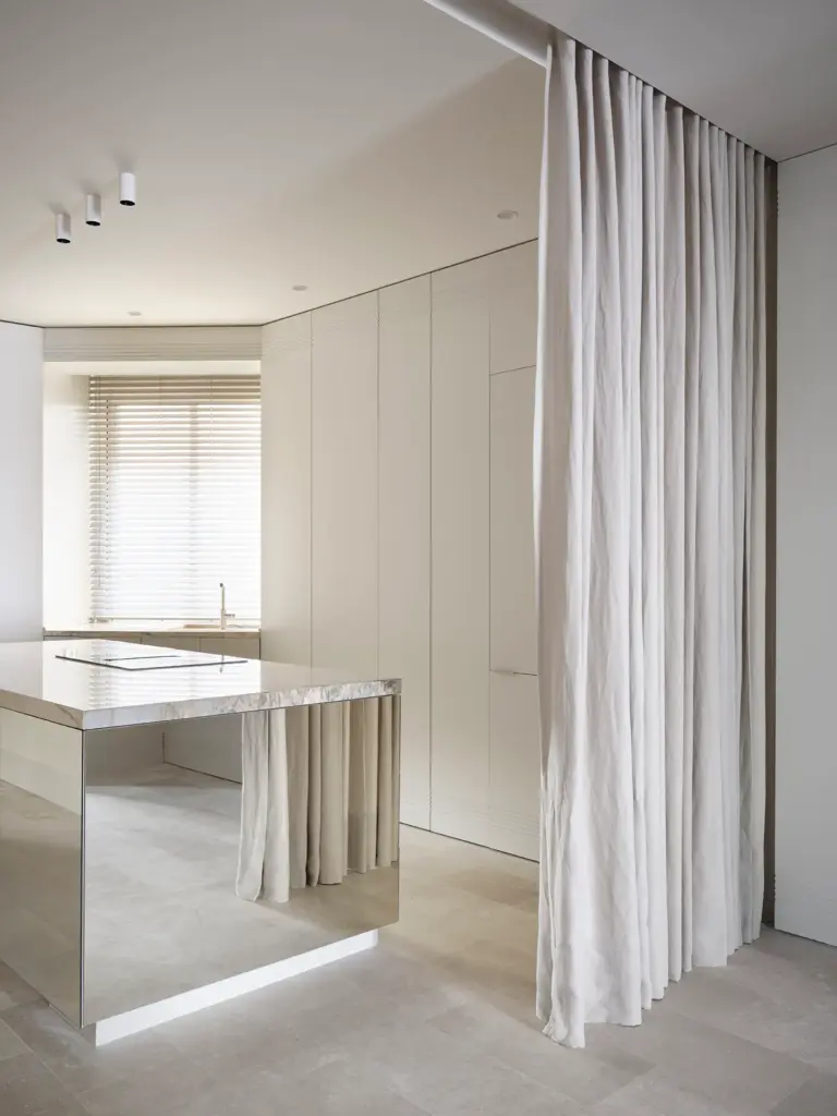 minimalist interior design kitchen with white walls and with a mirror like island