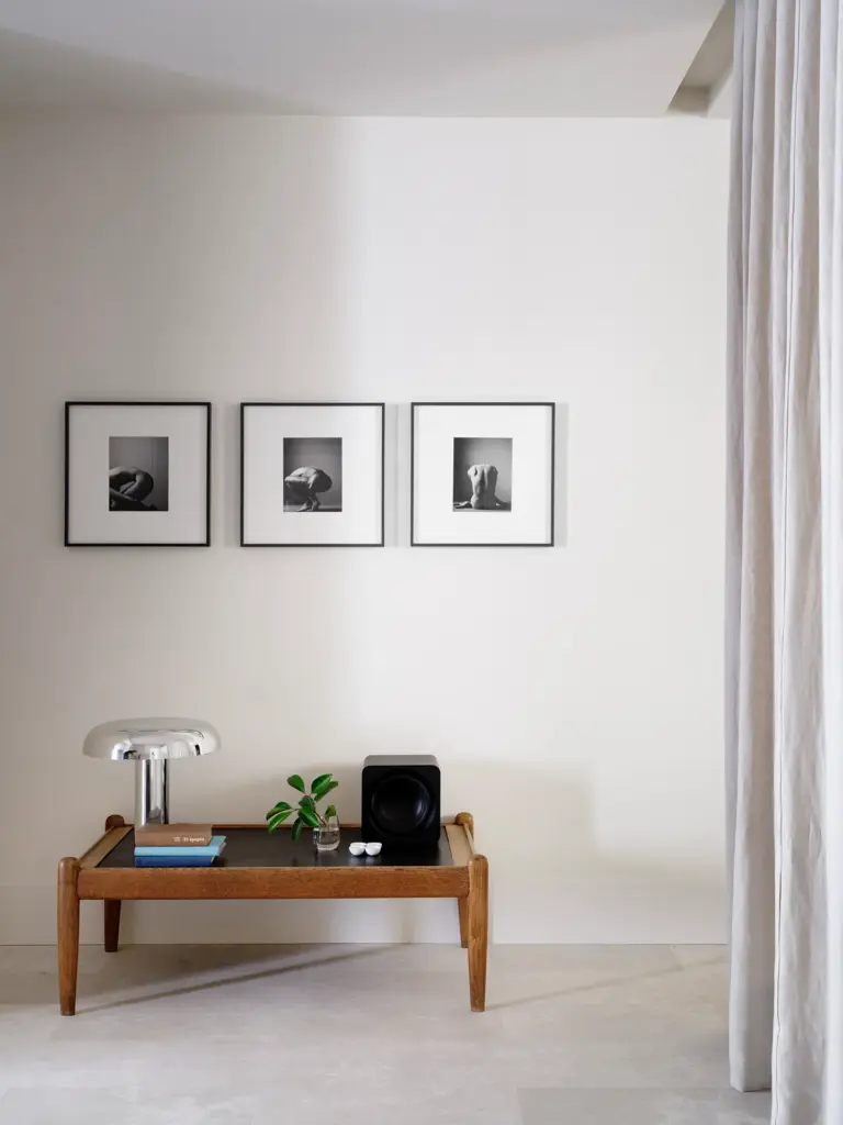 minimalist interior design entryway with white walls and with a wood bench