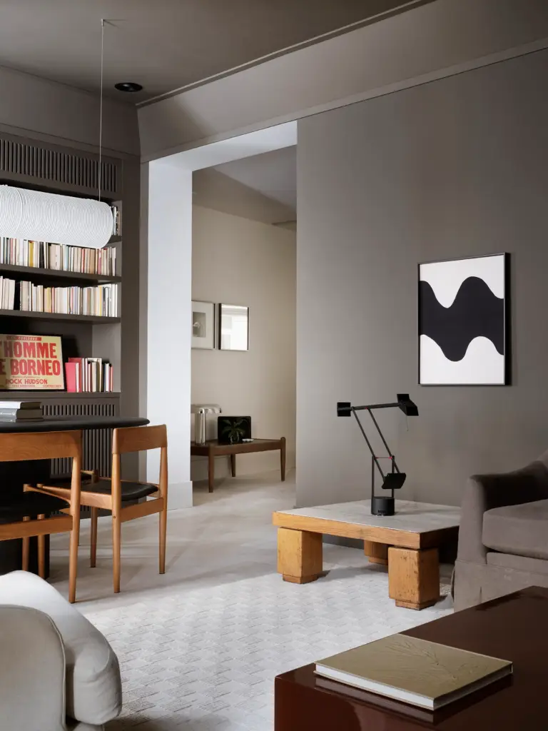 minimalist interior design living room with grey walls and with a wood side table and with a gray/brown sofa