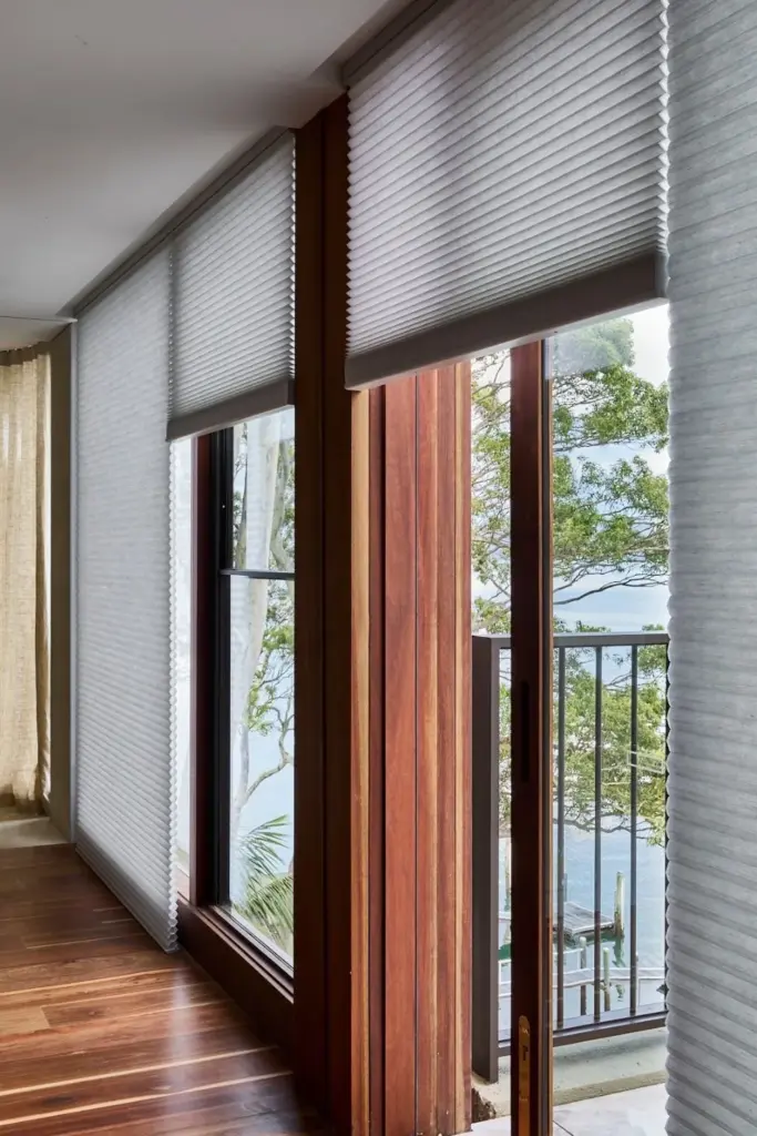 Jamie Durie’s Northern Beaches Home: A Showcase of Biophilic Architecture , spacious living space, with large windows and natural light, unique furniture