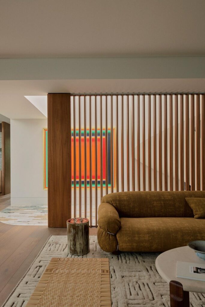 Coastal Home Decor Ideas Inspired by a Cliffside Sydney Residence, living area with handmade rugs, unique furniture pieces